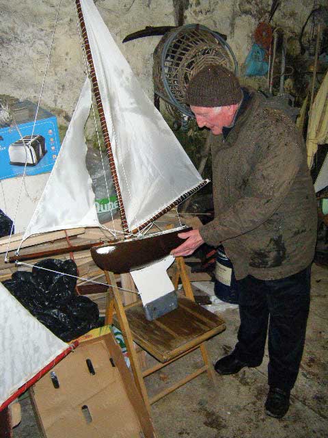 Loughie inspects Douglas's new-look boat. Photo: SR